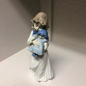 Girl with doll figurine